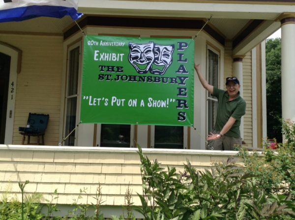 Bill Vinton shows off the exhibit banner